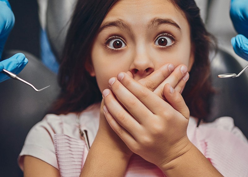 a girl hiding her mouth